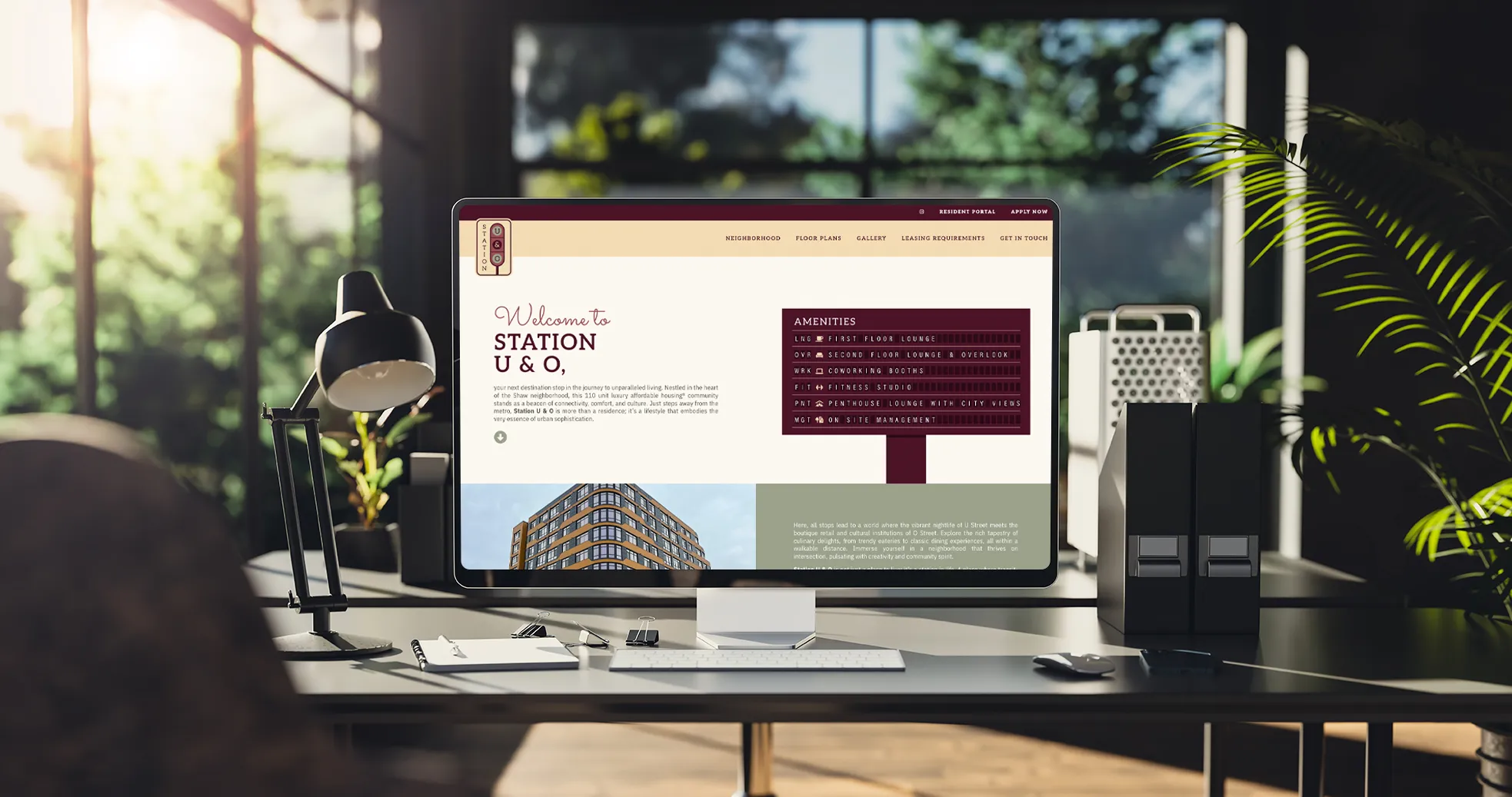 Station U & O website displayed on a monitor in a modern office